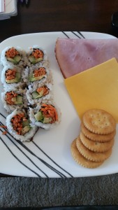 avocado sushi with ham and cheese crackers